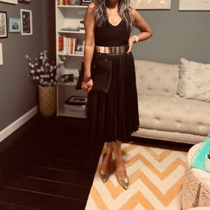 Beautiful black pleated cocktail dress by Halston.